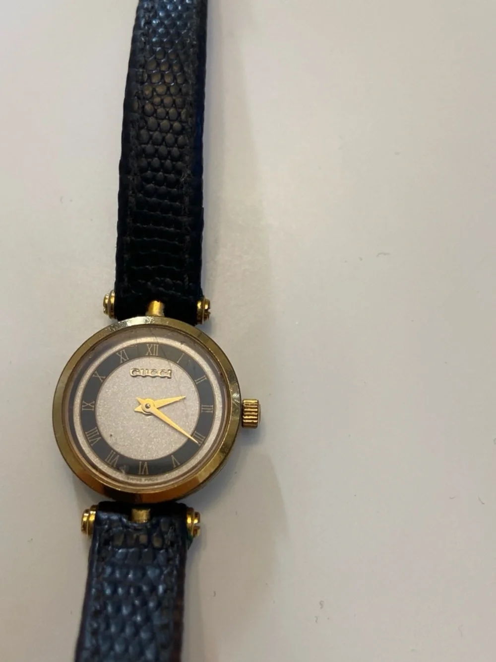 Gucci Black and Gold Round Dial Leather Strap Watch
